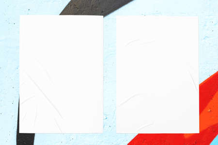 colorful urban wall with wrinkled two glued poster templateの写真素材