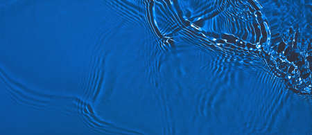 transparent dark blue clear calm water surface texture bannerの写真素材