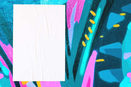 colorful urban wall with wrinkled glued poster templateの写真素材