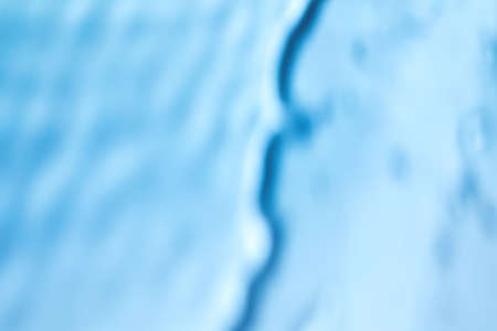 shadow and light caustic effect on blue wall