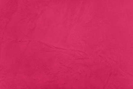 Saturated crimson red colored low contrast Concrete textured backgroundの写真素材