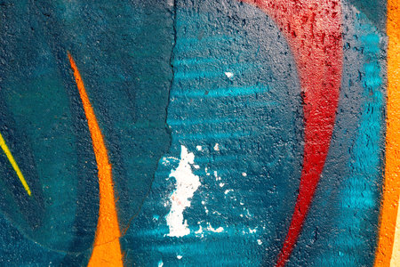 colorful teal, red and orange urban wall texture backgroundの写真素材