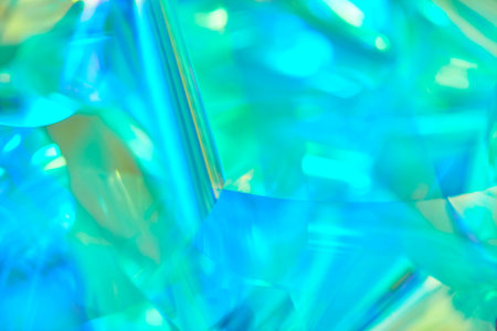 pastel neon mint, turquoise, blue, green holographic metallic foil backgroundの写真素材