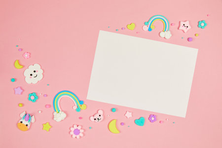 Blank white card on pastel pink background with kawaii cartoon animalsの写真素材