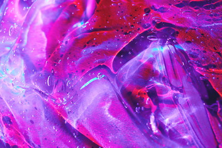 Abstract magenta pink, purple, red, blue cosmetic gel serum background textureの写真素材