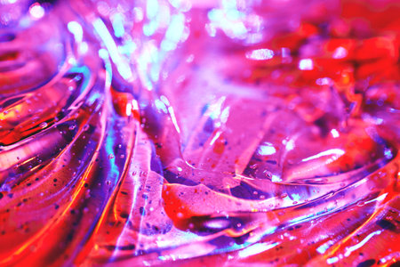 Abstract magenta pink, purple, red, blue cosmetic gel serum background textureの写真素材