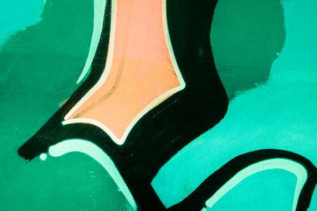 close up of colorful green, orange, black urban wall textureの写真素材