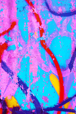 close up of colorful pink, red, blue, turquoise green urban wall texture