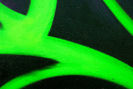 Neon Green Graffiti Spray on Black Urban Wall for 90s, Y2K Aestheticの写真素材