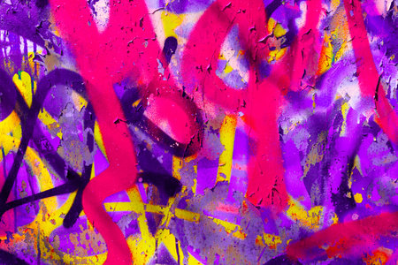 Graffiti on Urban Concrete Wall with Pink and Purple Spray Paint