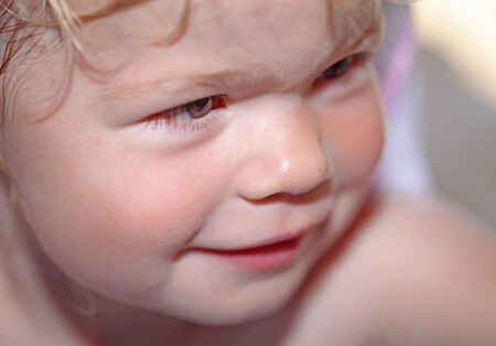 Adorable little girl laughing outside