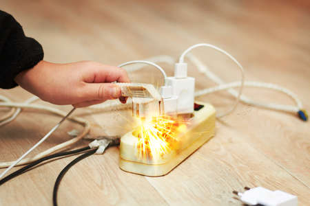 An overloaded extension cord is dangerous for children and adults electric shock may occur