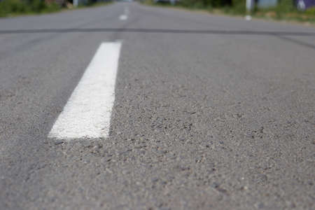 marking on the road going into the distance, asphalt road.