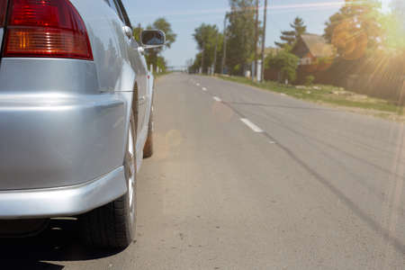 The car is standing on an asphalt road and the concept is on the way.