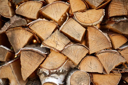 The chopped firewood lies in a pile intended for the fireplace.の写真素材
