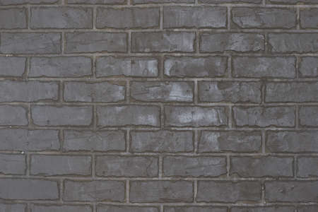 Gray wall in the form of brickwork repair and decoration of walls.の写真素材