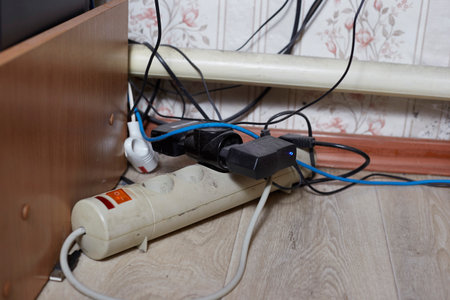 Electrical outlet on the floor in the kitchen. Close-up.
