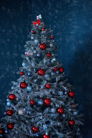 Christmas tree with red and blue baubles on a blue backgroundの写真素材