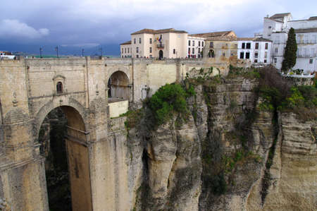 Stormy weather over the bridge in Ronda,Andalucia の写真素材