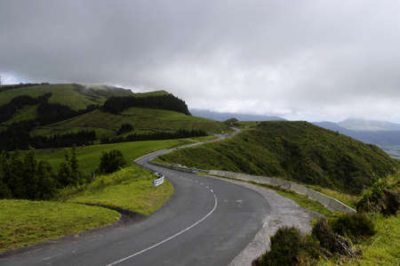 The winding road among the hills Salto do Cavalo, Sao Miguel, Azores, Portugal 