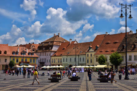 SIBIU, ROMANIA - JUNE 08, 2014  Tourists visit main square in Sibiu, Romania  Sibiu was designated a European Capital of Culture for the year 2007のeditorial素材