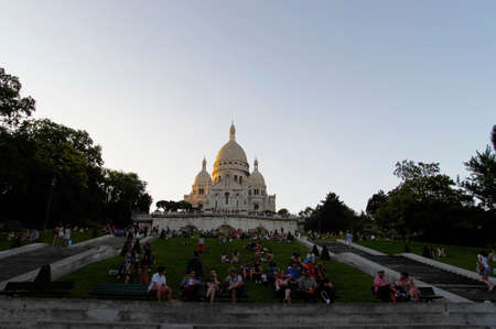 PARIS, FRANCE - JULY 1 2014: Tourist at the Sacre-Coeur Basilica on July 1, 2014 in Paris, France. The Sacre Coeur is a Catholic basilica, dedicated to the Sacred Heart.のeditorial素材