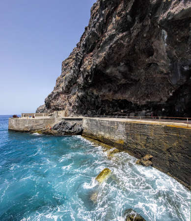 Natural sea pool in the destroyed village of La Dama, La Gomer island, Canary, Spainの写真素材