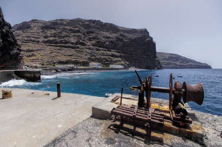 Old machinery at the sea coast in the destroyed village La Dama, La Gomer island, Canary, Spainの写真素材