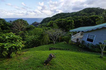CASTLE BRUCE, DOMINICA - JANUARY 4, 2017 - The stylish cottage on west coast of Dominica island on January 4, 2017. Castle Bruce is village in west of Dominica island, Lesser Antillesのeditorial素材