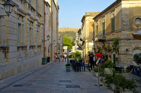 RAGUSA IBLA, ITALY - AUGUST 11th, 2017: People are preparing for the evening in old center of Ragusa...
