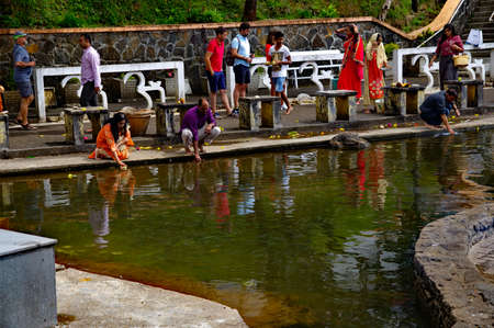 GRAND BASSIN/ MAURITIUS - AUGUST 18, 2018: The faithful pray at edge of Ganga Talao crater lake at Grand Bassin. It is the most sacred Hindu place in Mauritius.のeditorial素材