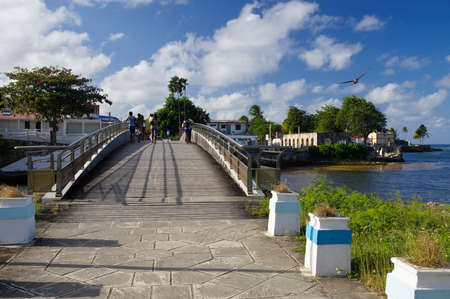 LE MOULE/GUADELOUPE - JANUARY 31, 2018: People on the bridge connecting two part of Le Moule town in Guadeloupe, Grande-Terre island, french West Indiesのeditorial素材