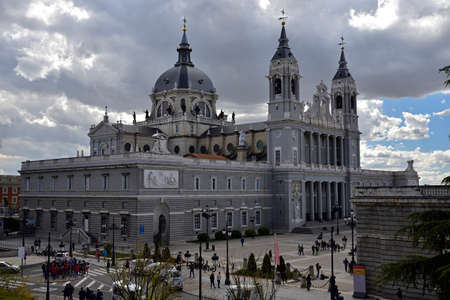 MADRID / SPAIN - APRIL 11, 2019 - Almudena Cathedral Catedral de Santa Maria la Real de la Almudenaon on the other side of the Royal Palace in Madrid, Spain.のeditorial素材