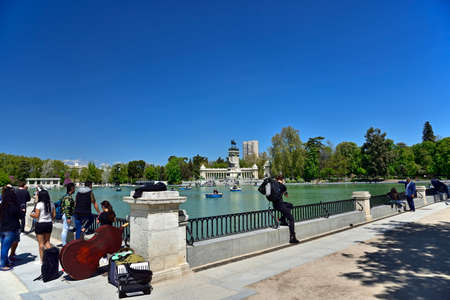 MADRID / SPAIN - APRIL 12, 2019 - Young people in The Jardines del Buen Retiro (Parque del Buen Retiro), the main park of the city of Madrid, capital of Spain.のeditorial素材