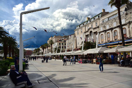 SPLIT, CROATIA - APRIL 29, 2019: People on the Splitska Riva promenade in Split on early spring day, Croatiaのeditorial素材