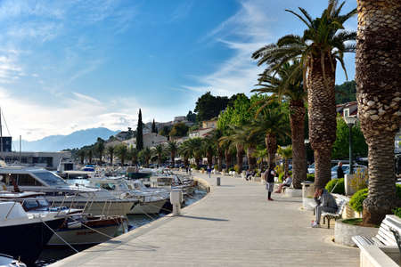 BRELA, CROATIA - MAY 3, 2019 - The boardwalk in the harbor at Brela. The Makarska riviera in Croatia...