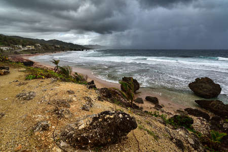 Stormy weather above famous rocks formation on the beach of Bathsheba, East coast of island Barbados, Caribbean Islandsの写真素材