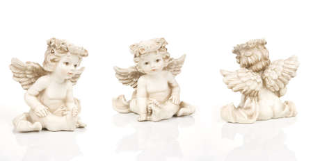 Three angels in other poses on whiteの写真素材