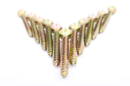 Gold screws on white, backgroundの写真素材