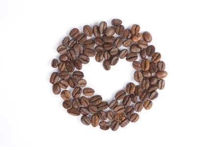 Coffee beans on white, heart symbolの写真素材