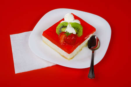 Red dessert, on white plateの写真素材
