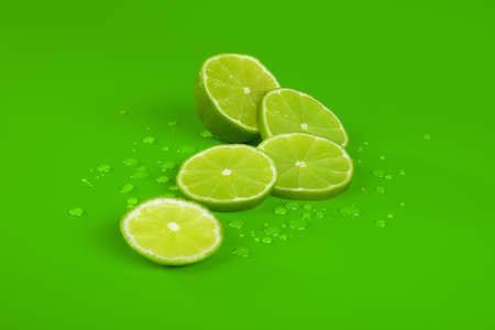 Lime and drop on greenの写真素材