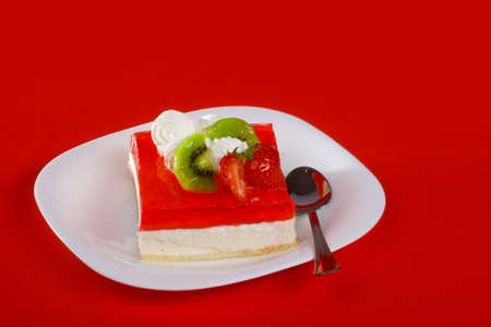 Cake's dessert on the white plate with spoonの写真素材