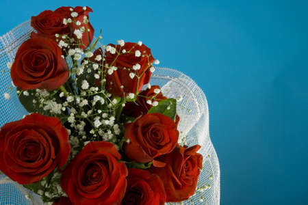 Rose's bouquet with white little flowersの写真素材