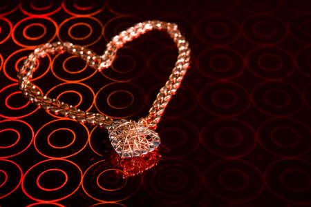 Pendant and Chain are in heart form on a holographic foil