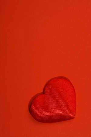 red textile heart is on the red oneの写真素材