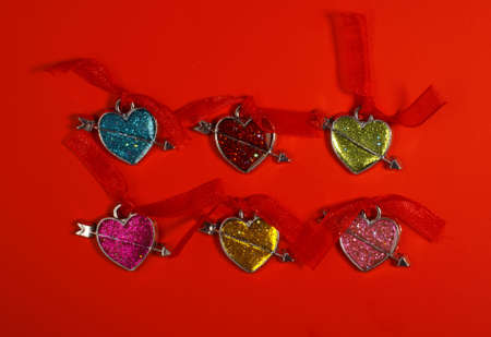 Six hearts in different color with red ribbon. の写真素材