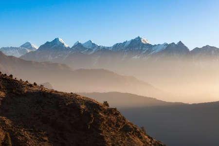 Mystic mountain sunrise scenery in Himalayas, Nepal. Stunning misty mountains scenery with high altitude peaks and Everest mountain on the background.の写真素材