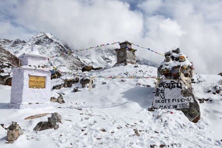 EVEREST BASE CAMP TREK/NEPAL - OCTOBER 30, 2015: Memorial chortens to honour expedition leader Scott Fischer and other famous Everest climbers. And buddhist prayer flags flattering on the wind.のeditorial素材