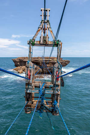 Cable car to small rocky island near Timang beach, Java, Indones.の写真素材